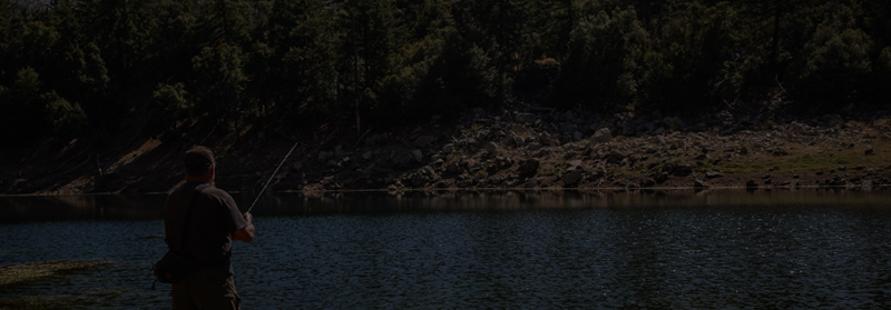 man fishing on lake